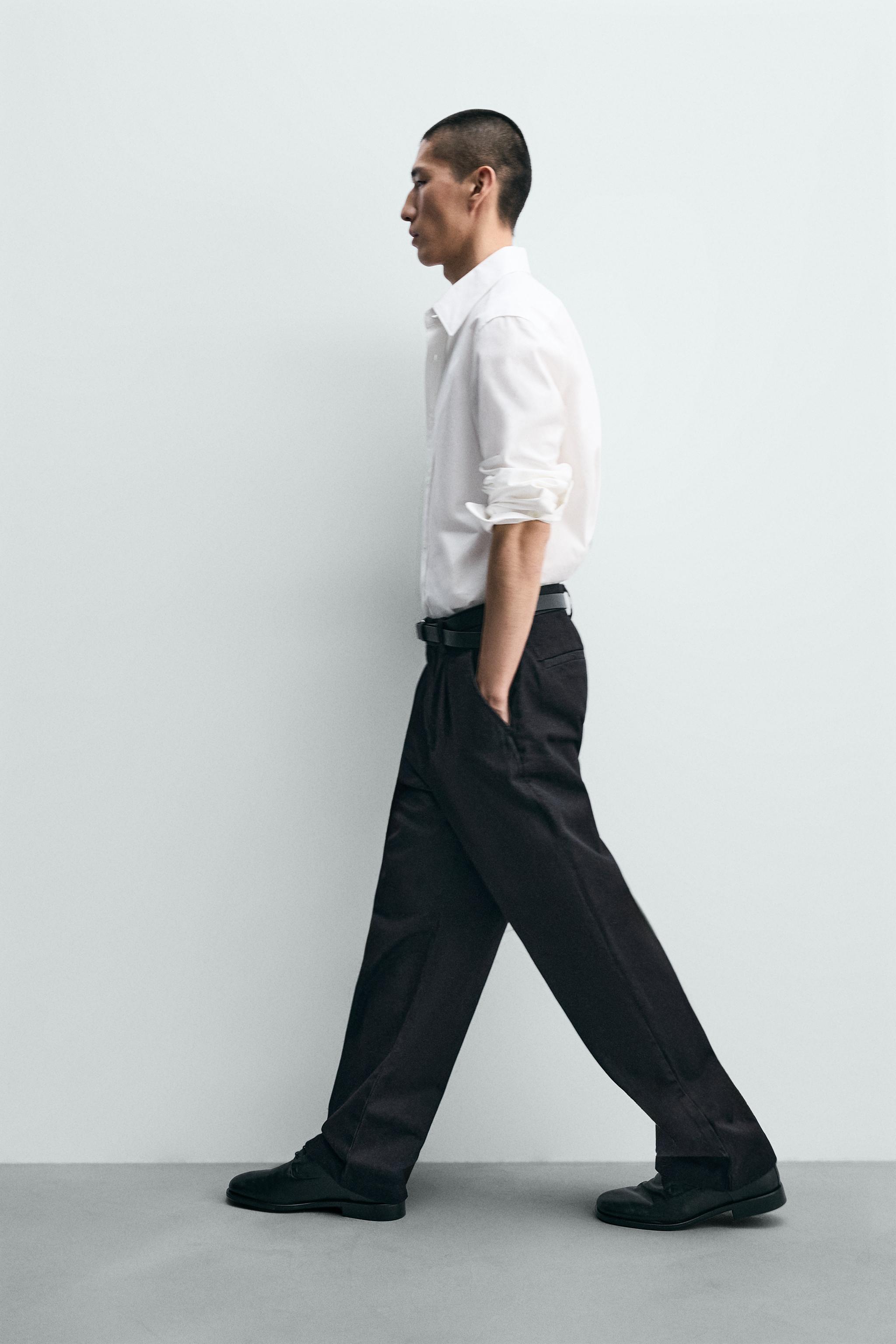 PANTALON CHINO EN DENIM À PLIS